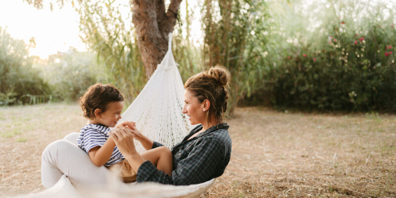 Relaxing moments in a hammock Photo of a little boy and his mother having a relaxing moment in a hammock