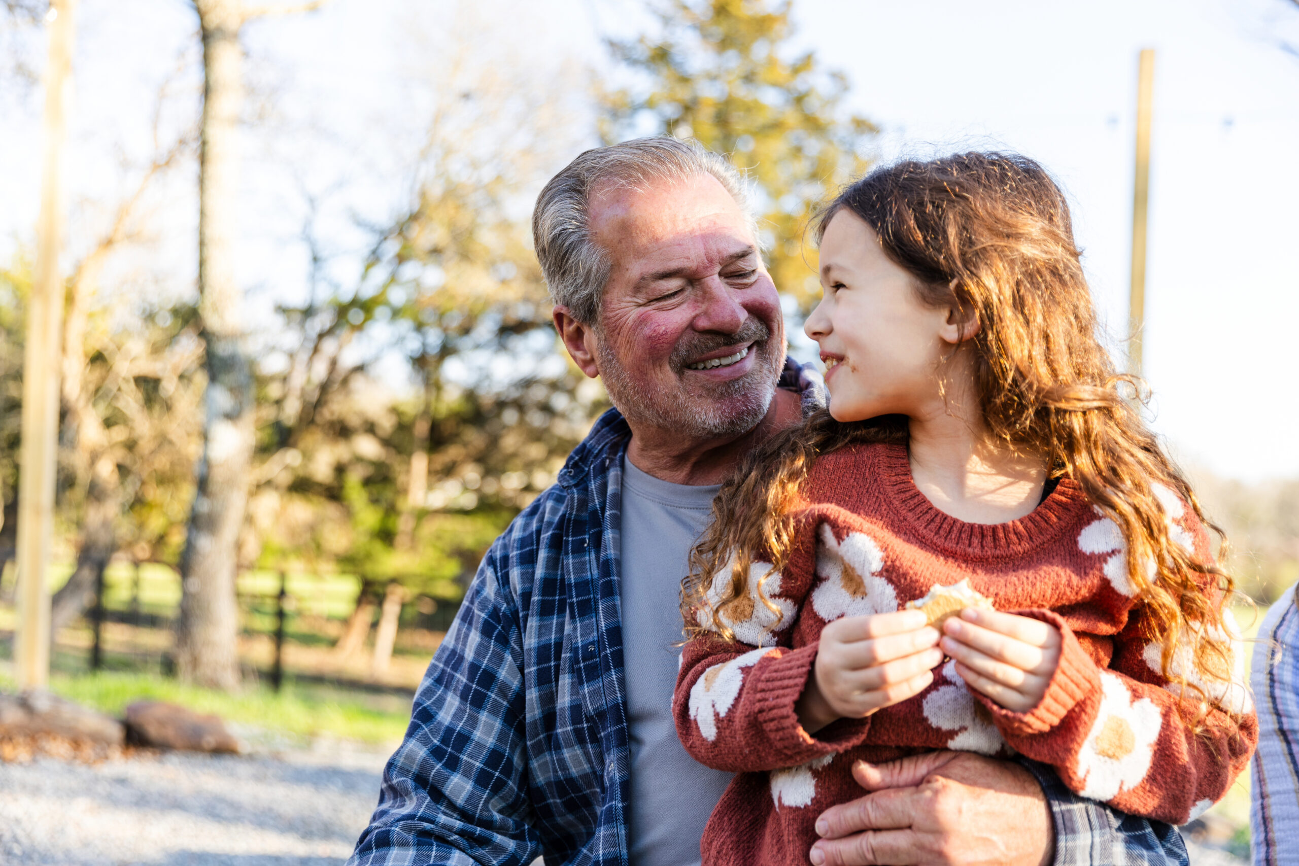 Elementary age girl has wonderful time outdoors with grandfather